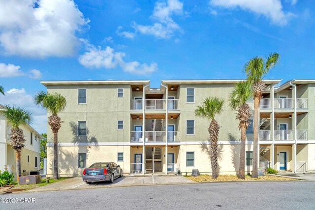 216 Bonita Cir Unit C, Panama City, FL 32408 - view of apartment building / complex featuring uncovered parking