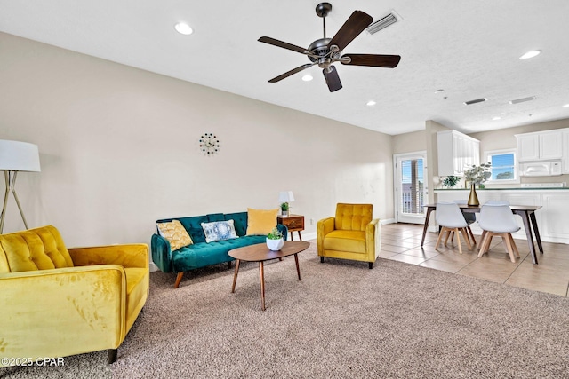 216 Bonita Cir Unit C, Panama City, FL 32408 - living room with recessed lighting, ceiling fan, light tile patterned floors, and light colored carpet