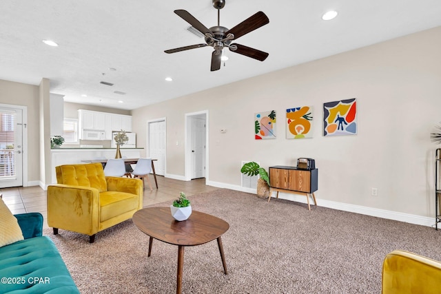 216 Bonita Cir Unit C, Panama City, FL 32408 - living room with recessed lighting, a ceiling fan, baseboards, light tile patterned flooring, and light carpet