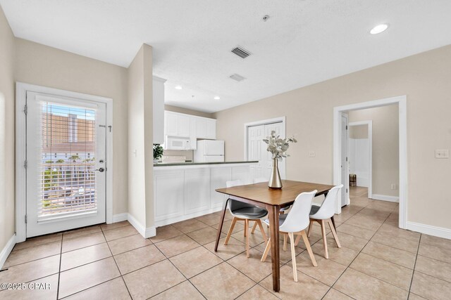 216 Bonita Cir Unit C, Panama City, FL 32408 - dining room with light tile patterned floors, baseboards, and recessed lighting