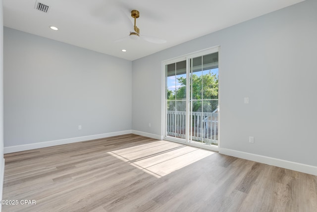 12809 Merial Green Way, Southport, FL 32409 - unfurnished room featuring baseboards, light wood-style floors, ceiling fan, and recessed lighting