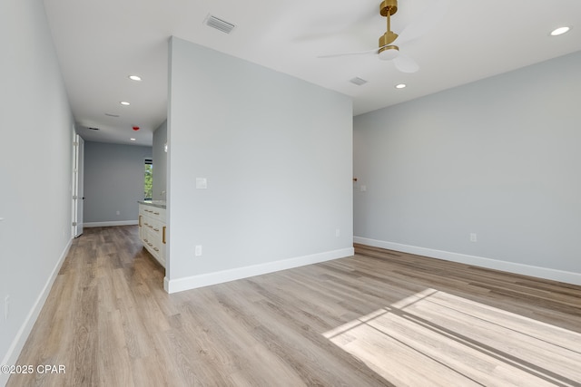 12809 Merial Green Way, Southport, FL 32409 - spare room with ceiling fan, light wood-style flooring, recessed lighting, and baseboards