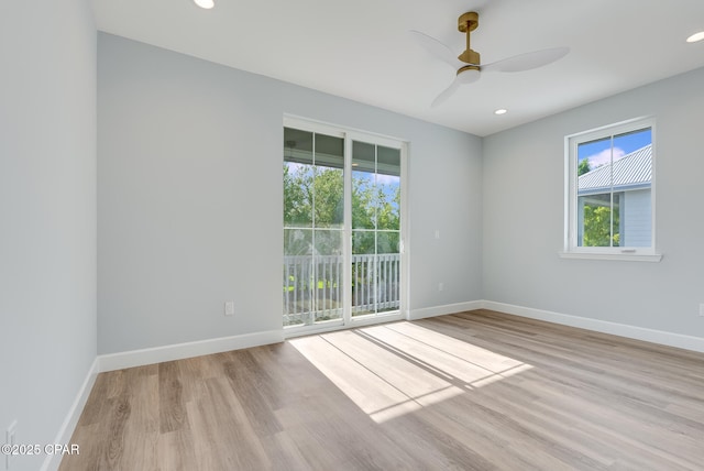 12809 Merial Green Way, Southport, FL 32409 - empty room featuring wood finished floors, ceiling fan, and recessed lighting