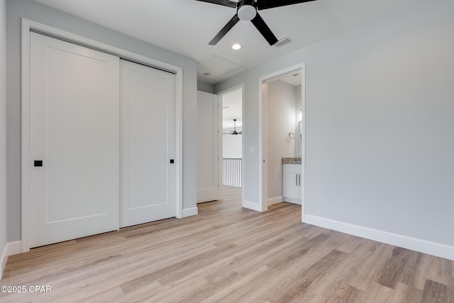 12809 Merial Green Way, Southport, FL 32409 - unfurnished bedroom with light wood-type flooring, a closet, recessed lighting, and ceiling fan