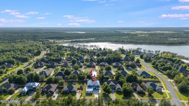 12809 Merial Green Way, Southport, FL 32409 - view of property location with a large body of water, a forest, and nearby suburban area