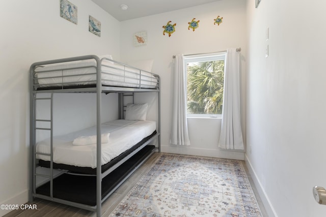 13826 Front Beach Rd, Panama City Beach, FL 32413 - bedroom with wood finished floors and baseboards