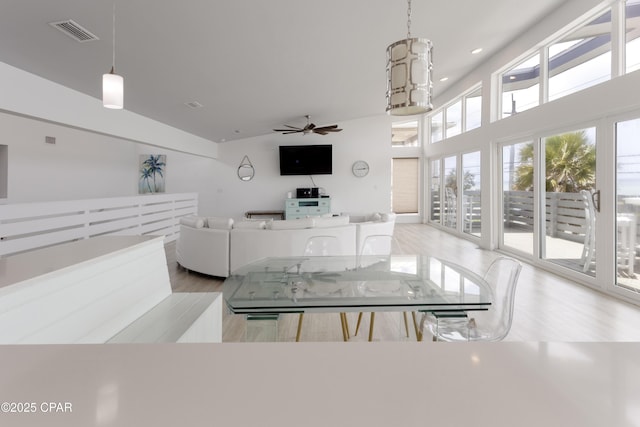13826 Front Beach Rd, Panama City Beach, FL 32413 - dining space featuring light wood-style floors, high vaulted ceiling, ceiling fan, and recessed lighting