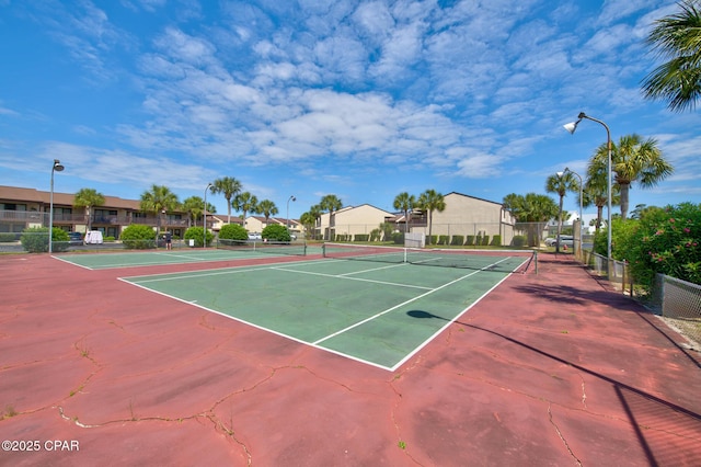 17620 Front Beach Rd Unit Y3, Panama City Beach, FL 32413 - view of tennis court with fence and a residential view