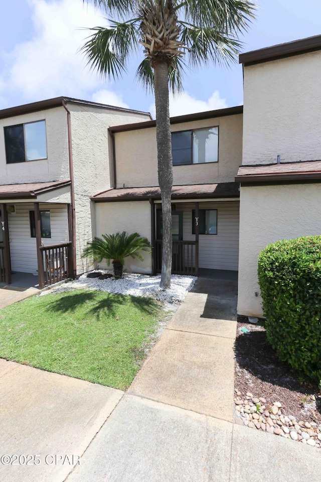 17620 Front Beach Rd Unit Y3, Panama City Beach, FL 32413 - townhome / multi-family property featuring stucco siding and covered porch