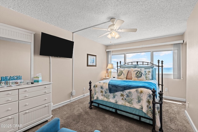 23223 Front Beach Rd Unit A509, Panama City Beach, FL 32413 - carpeted bedroom featuring a textured ceiling, a ceiling fan, and baseboards