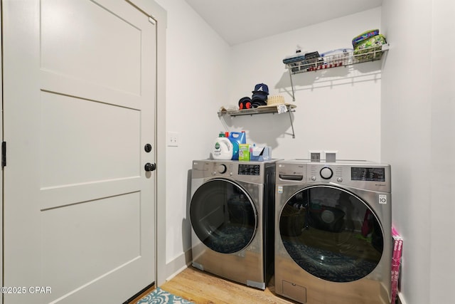 3928 Sandpine Way, Panama City, FL 32404 - laundry area with washing machine and dryer, light wood finished floors, and baseboards