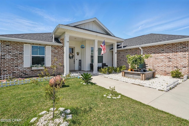 3928 Sandpine Way, Panama City, FL 32404 - view of front of property with a front lawn, brick siding, and board and batten siding