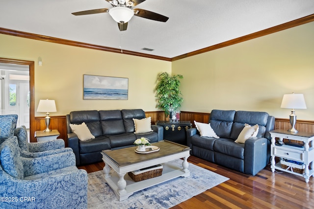 18562 Lois Fowler Rd, Blountstown, FL 32424 - living room featuring wainscoting, ceiling fan, wood finished floors, crown molding, and wooden walls