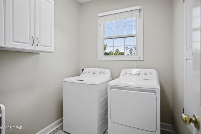 18562 Lois Fowler Rd, Blountstown, FL 32424 - laundry area featuring cabinet space, washing machine and clothes dryer, and baseboards
