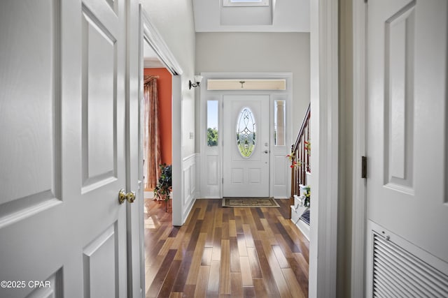 18562 Lois Fowler Rd, Blountstown, FL 32424 - foyer featuring dark wood-style floors and a wainscoted wall