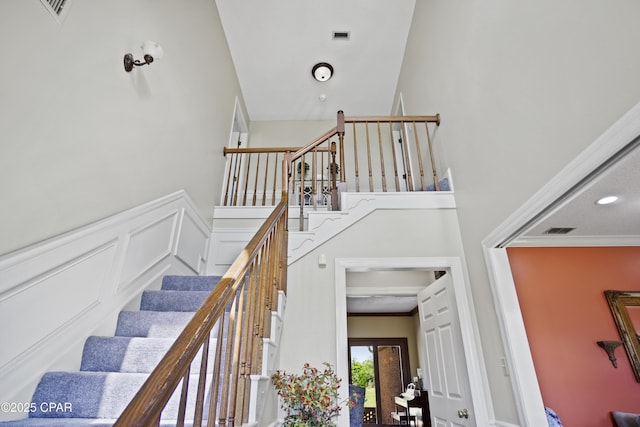 18562 Lois Fowler Rd, Blountstown, FL 32424 - staircase with a towering ceiling and crown molding