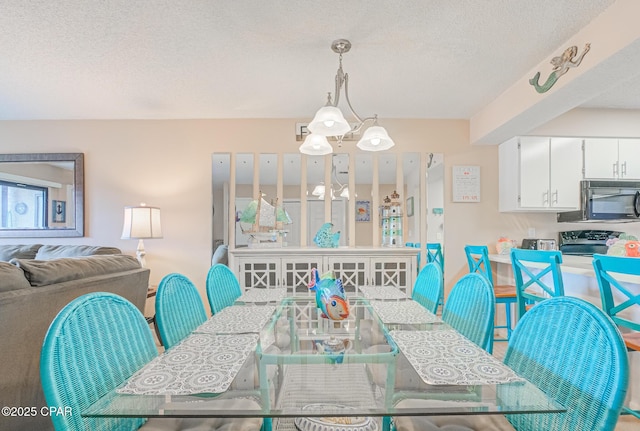 17620 Front Beach Rd Unit 2V, Panama City Beach, FL 32413 - dining space featuring a textured ceiling