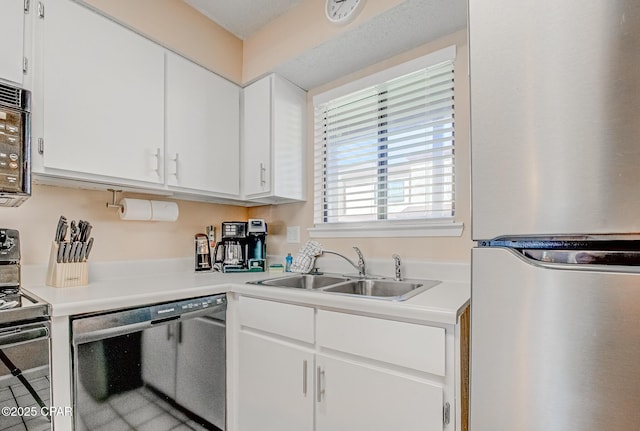 17620 Front Beach Rd Unit 2V, Panama City Beach, FL 32413 - kitchen featuring freestanding refrigerator, dishwashing machine, electric range oven, a sink, and white cabinets