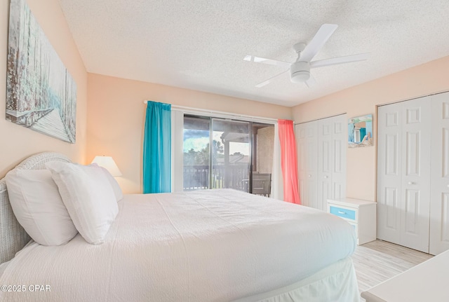 17620 Front Beach Rd Unit 2V, Panama City Beach, FL 32413 - bedroom featuring access to outside, two closets, wood finished floors, a textured ceiling, and a ceiling fan