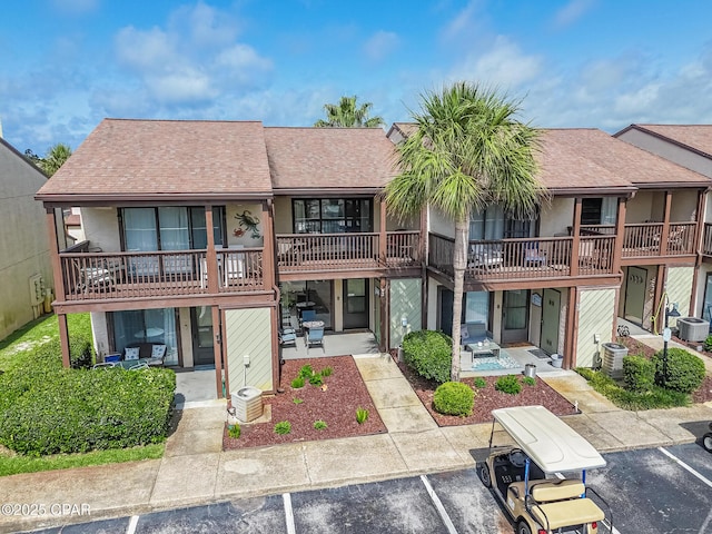 17620 Front Beach Rd Unit 2V, Panama City Beach, FL 32413 - view of property with uncovered parking and central AC
