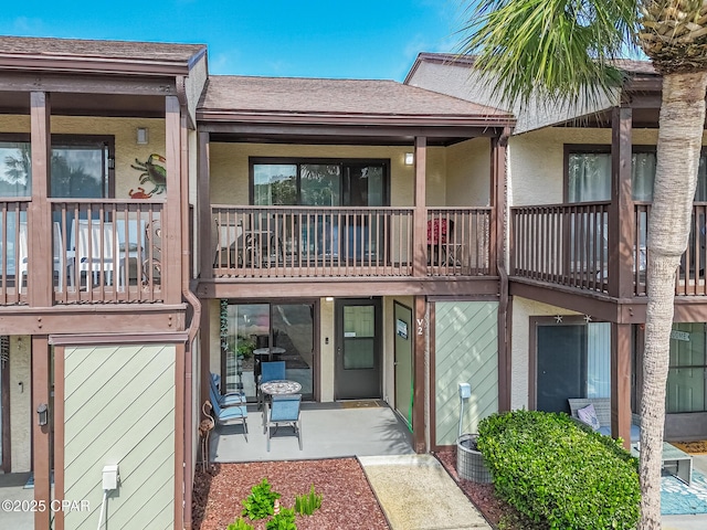 17620 Front Beach Rd Unit 2V, Panama City Beach, FL 32413 - rear view of property with roof with shingles and stucco siding