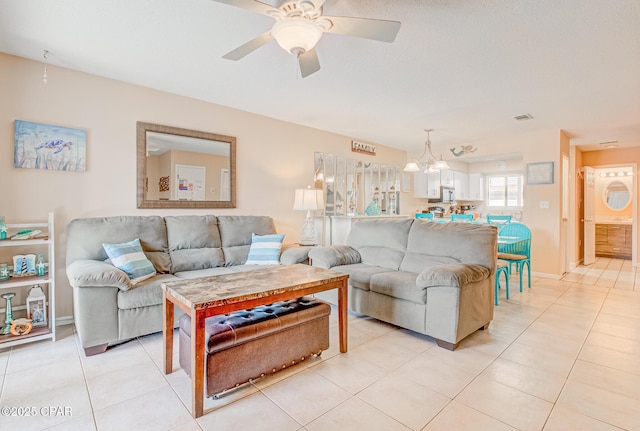 17620 Front Beach Rd Unit 2V, Panama City Beach, FL 32413 - living area featuring light tile patterned floors, ceiling fan, and a chandelier