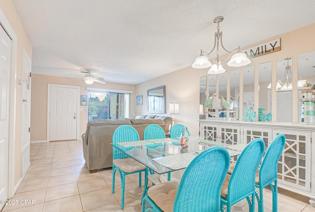 17620 Front Beach Rd Unit 2V, Panama City Beach, FL 32413 - tiled dining room featuring a textured ceiling, a ceiling fan, and a chandelier