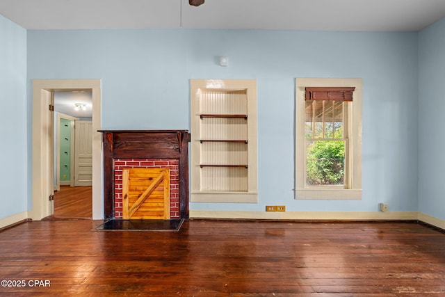 208 N E Ave, Panama City, FL 32401 - unfurnished living room featuring hardwood / wood-style floors