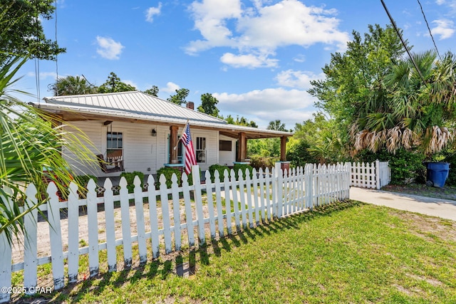 208 N E Ave, Panama City, FL 32401 - view of front of house with covered porch and metal roof