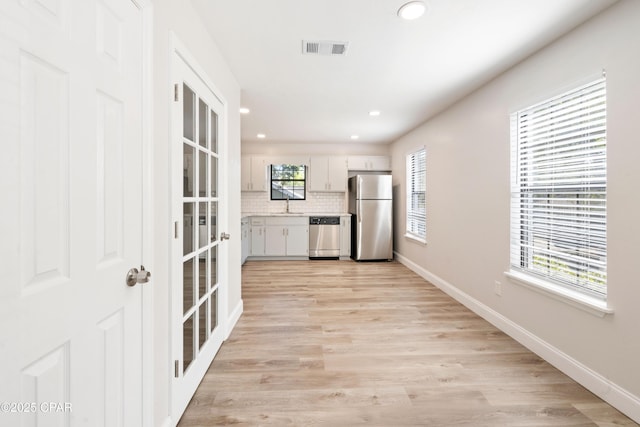 4130 White Pine Ct, Tallahassee, FL 32311 - kitchen featuring stainless steel appliances, decorative backsplash, light countertops, baseboards, and recessed lighting