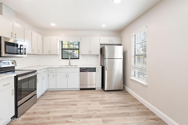 4130 White Pine Ct, Tallahassee, FL 32311 - kitchen with stainless steel appliances, a sink, plenty of natural light, backsplash, and recessed lighting