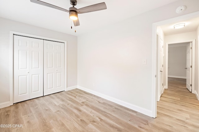 4130 White Pine Ct, Tallahassee, FL 32311 - unfurnished bedroom with light wood-style flooring, baseboards, a closet, and a ceiling fan