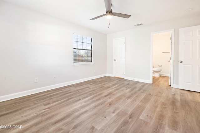 4130 White Pine Ct, Tallahassee, FL 32311 - unfurnished bedroom featuring light wood finished floors, baseboards, connected bathroom, and ceiling fan