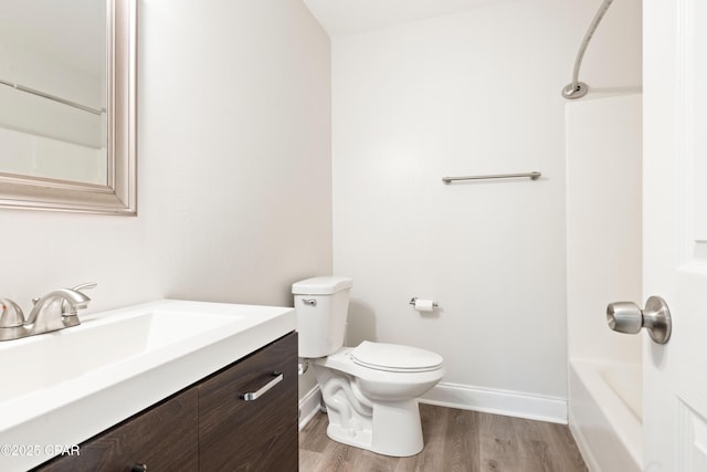 4130 White Pine Ct, Tallahassee, FL 32311 - full bathroom with vanity, wood finished floors, toilet, baseboards, and bathtub / shower combination