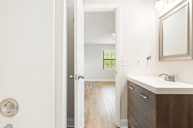 4130 White Pine Ct, Tallahassee, FL 32311 - bathroom featuring wood finished floors, vanity, and baseboards