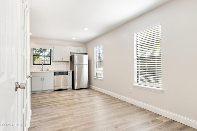 4130 White Pine Ct, Tallahassee, FL 32311 - kitchen featuring stainless steel appliances, a sink, light countertops, healthy amount of natural light, and recessed lighting