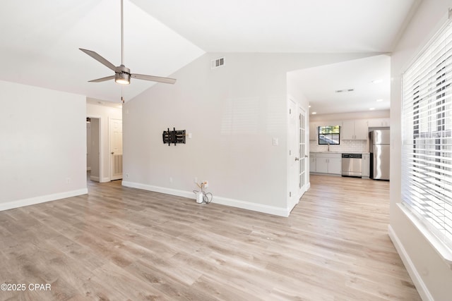 4130 White Pine Ct, Tallahassee, FL 32311 - unfurnished living room with lofted ceiling, a ceiling fan, healthy amount of natural light, light wood-style flooring, and baseboards
