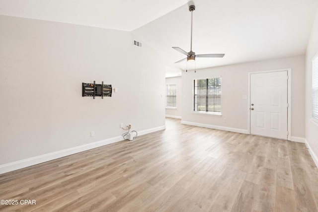 4130 White Pine Ct, Tallahassee, FL 32311 - unfurnished living room with light wood-style flooring, vaulted ceiling, baseboards, and a ceiling fan