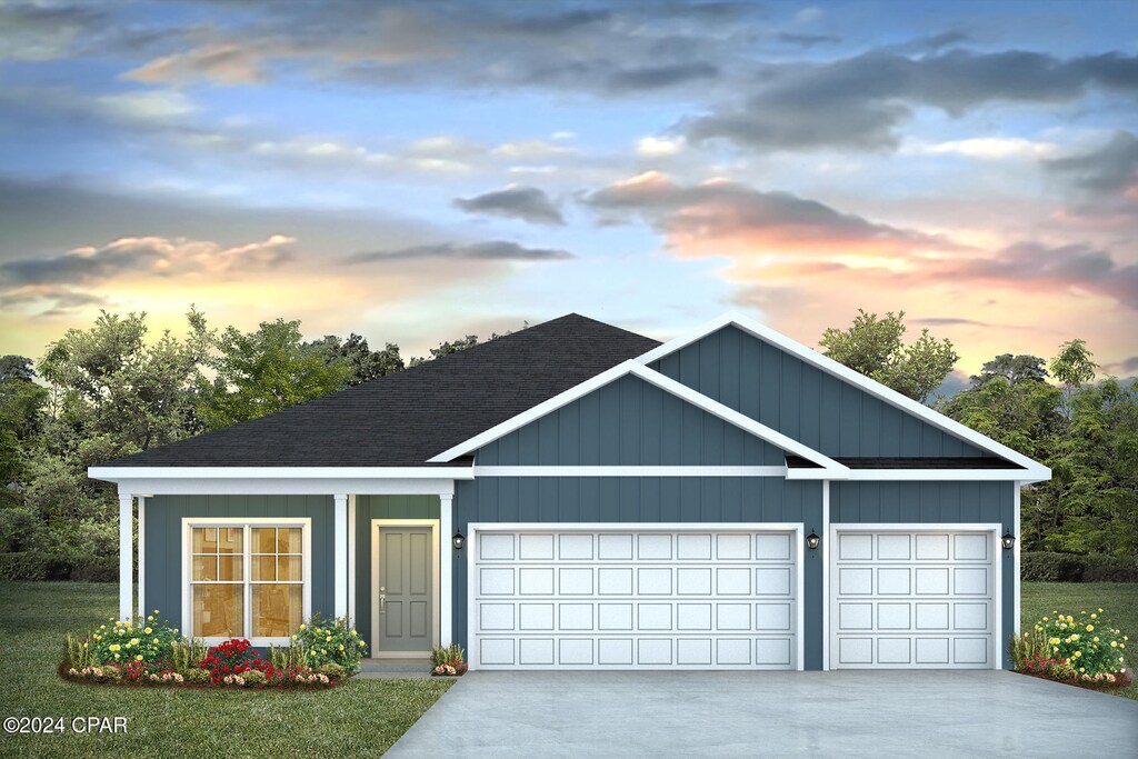 6544 Haskins Dr, Panama City, FL 32404 - view of front of property with a garage, driveway, roof with shingles, and board and batten siding