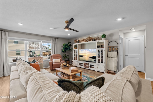 160 James Way, Southport, FL 32409 - living room featuring a ceiling fan, wood finished floors, recessed lighting, and a textured ceiling