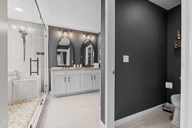 160 James Way, Southport, FL 32409 - full bathroom featuring a shower stall, toilet, vanity, tile patterned floors, and baseboards