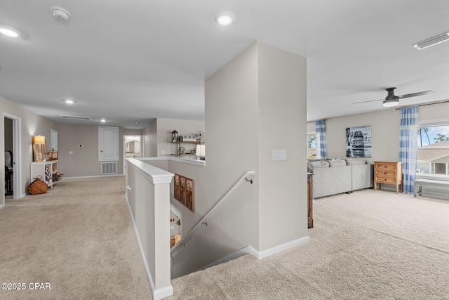 160 James Way, Southport, FL 32409 - corridor with an upstairs landing, light colored carpet, baseboards, and recessed lighting
