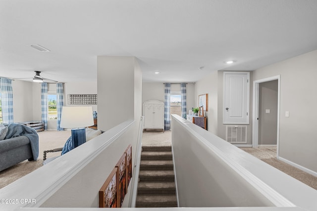 160 James Way, Southport, FL 32409 - hallway featuring light carpet, baseboards, plenty of natural light, and recessed lighting