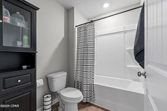 160 James Way, Southport, FL 32409 - bathroom with wood finished floors, toilet, and shower / bath combo with shower curtain