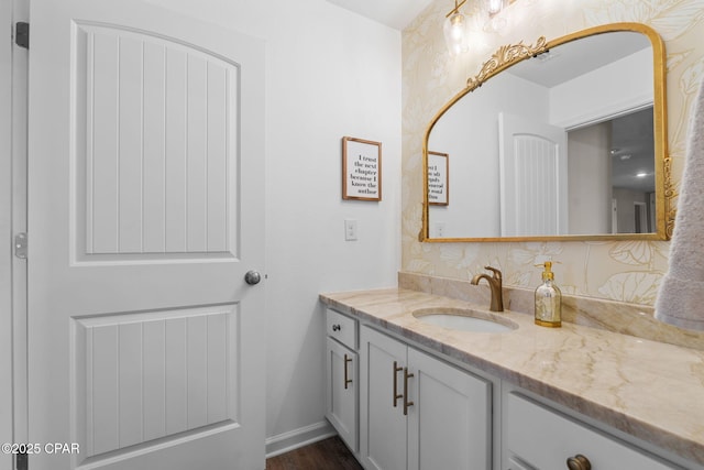 160 James Way, Southport, FL 32409 - bathroom with vanity, wood finished floors, and baseboards