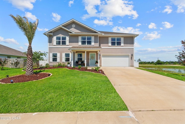 160 James Way, Southport, FL 32409 - view of front facade with concrete driveway, a garage, and a water view
