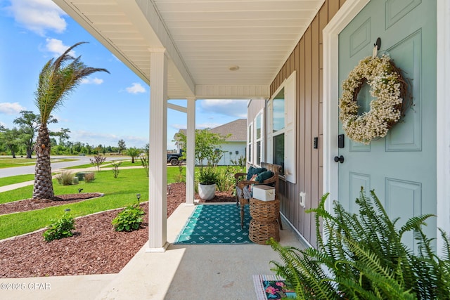 160 James Way, Southport, FL 32409 - covered porch with a lawn