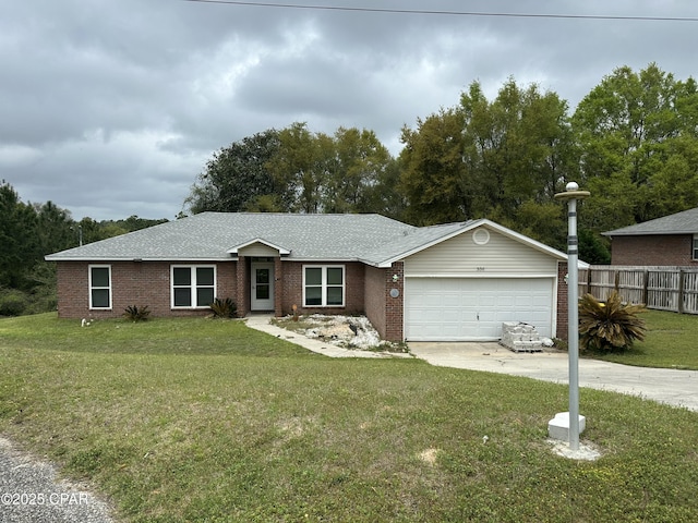 336 Egan Dr, Crestview, FL 32536 - ranch-style house featuring concrete driveway, an attached garage, brick siding, and a shingled roof