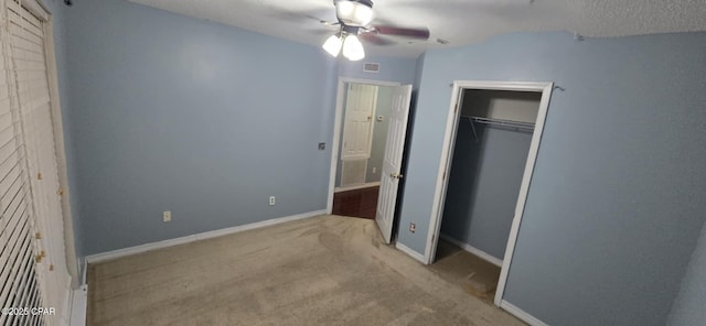336 Egan Dr, Crestview, FL 32536 - unfurnished bedroom with carpet, a closet, baseboards, and a ceiling fan