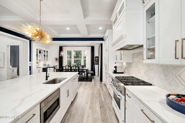 135 Buddy St, Santa Rosa Beach, FL 32459 - kitchen featuring range with gas stovetop, a sink, stainless steel microwave, a chandelier, and coffered ceiling